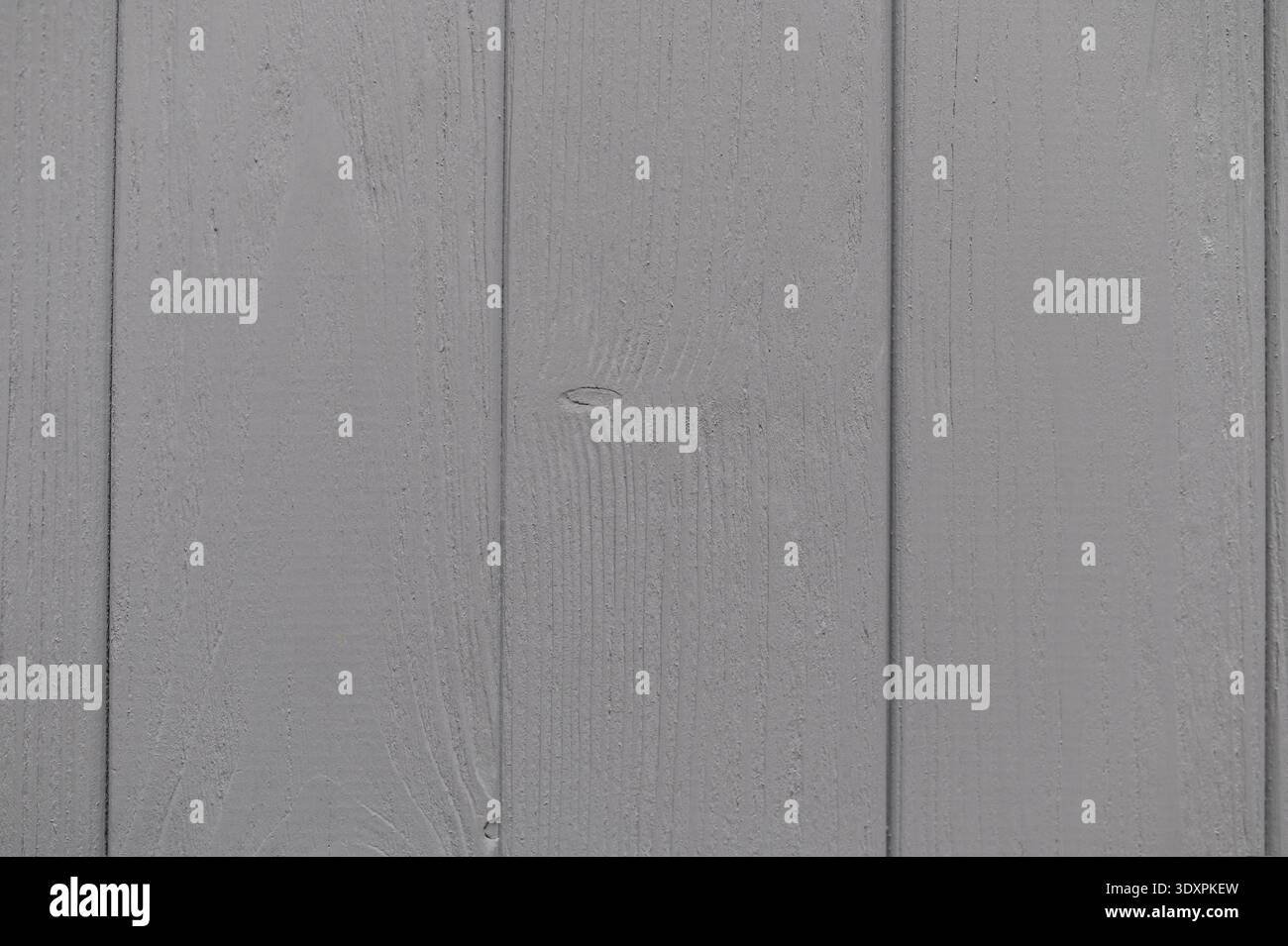 Gray painted wooden planks creating a rustic background texture, ideal for design projects and adding a charm of natural touch Stock Photo