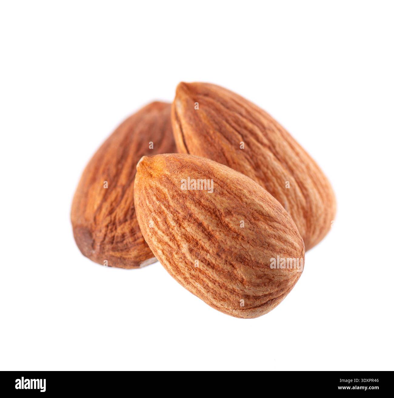 Almond nut isolated on white background. Brown almond nuts. Clipping path. Stock Photo