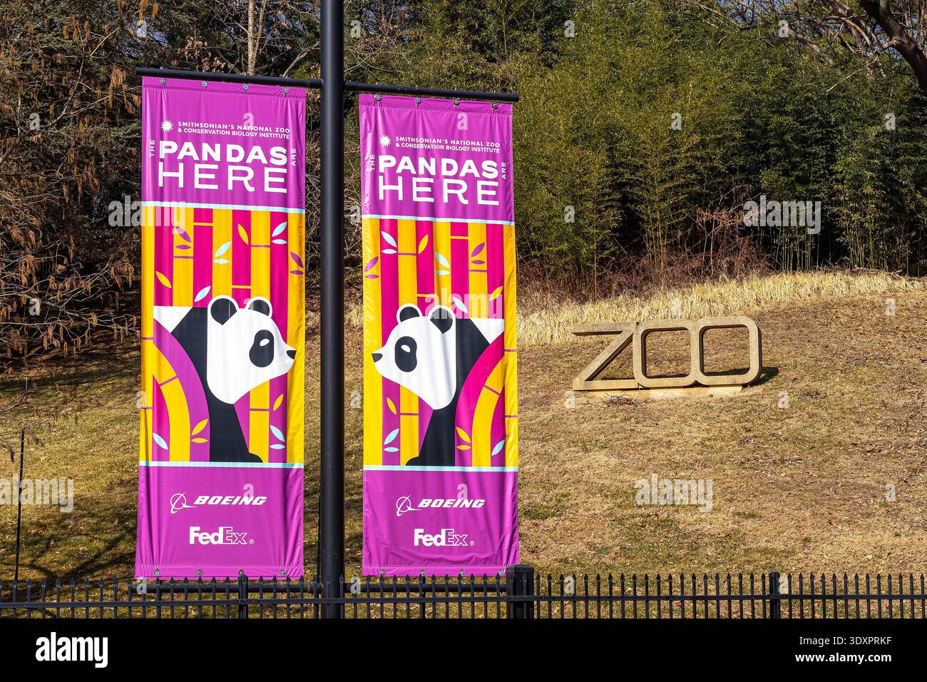 Smithsonian National Zoo entrance with zoo sign and banners reading "The pandas are here" with illustrations of giant pandas Stock Photo