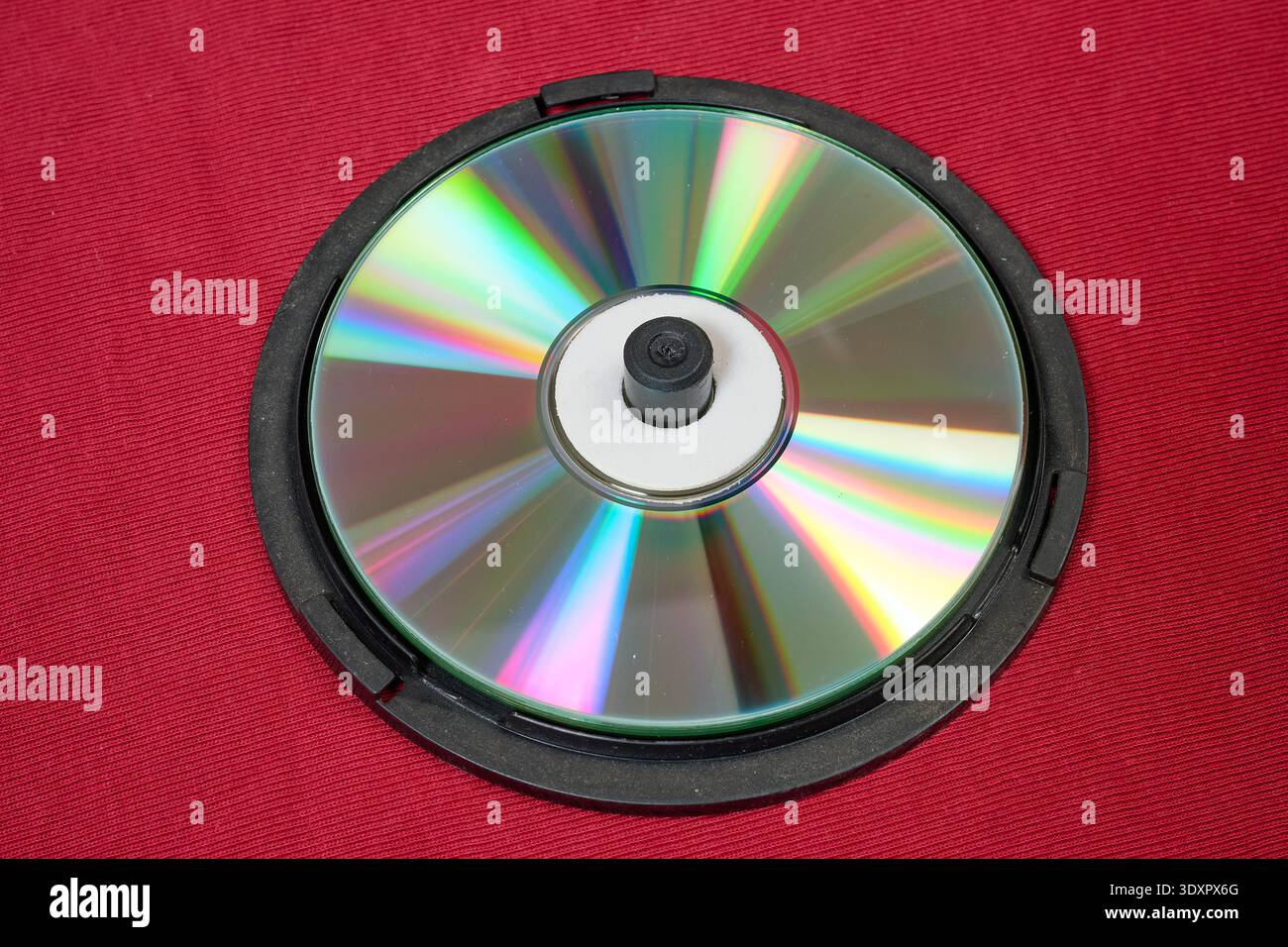 A case-style holder for blank CDs on red background Stock Photo