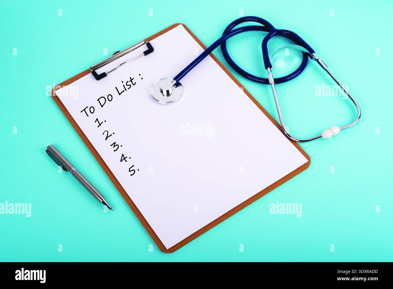 Medical To Do List on clipboard with stethoscope on blue background. Healthcare planning, doctor routine, and patient management concept. Stock Photo
