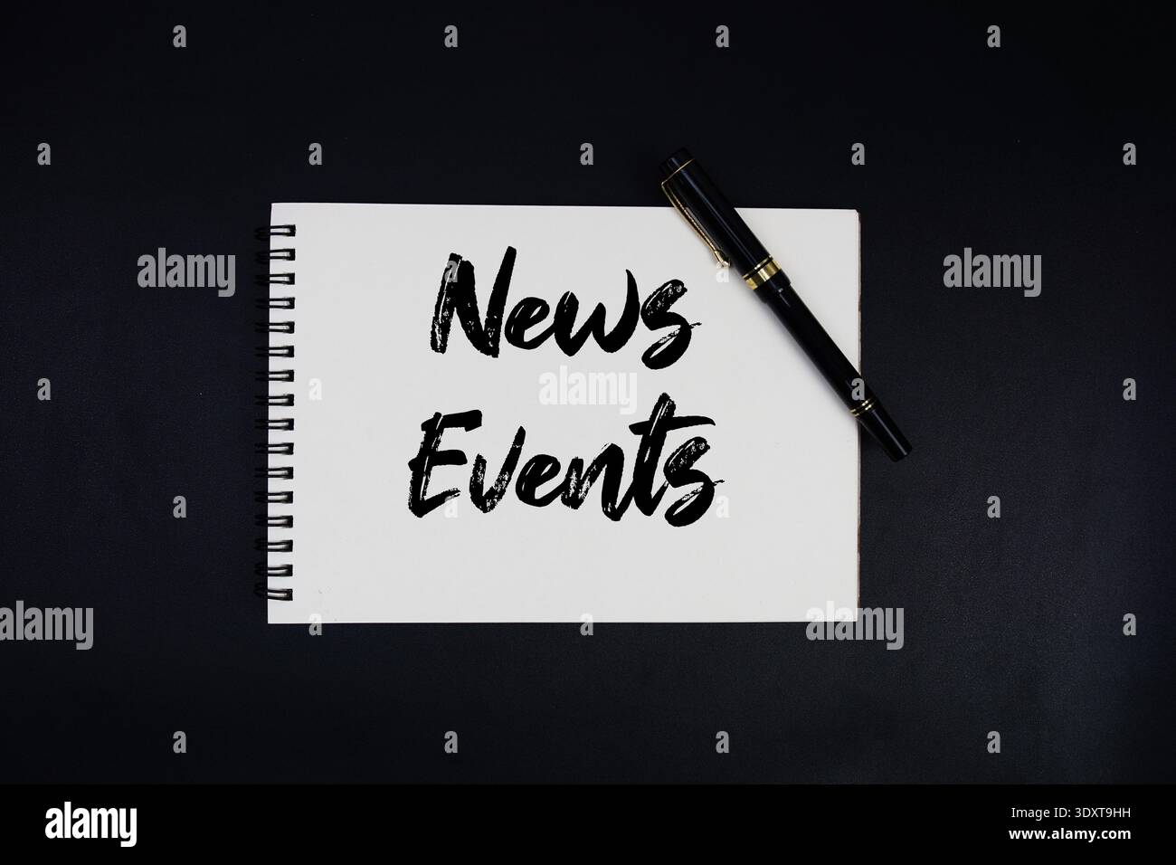 News Events text written on notepad Stock Photo