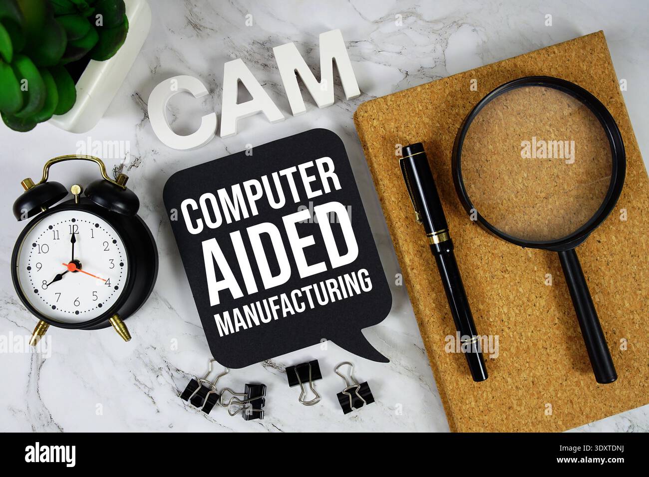 CAM - Computer Aided Manufacturing acronym with alarm clock and magnifying glass, technology and communication concept background Stock Photo