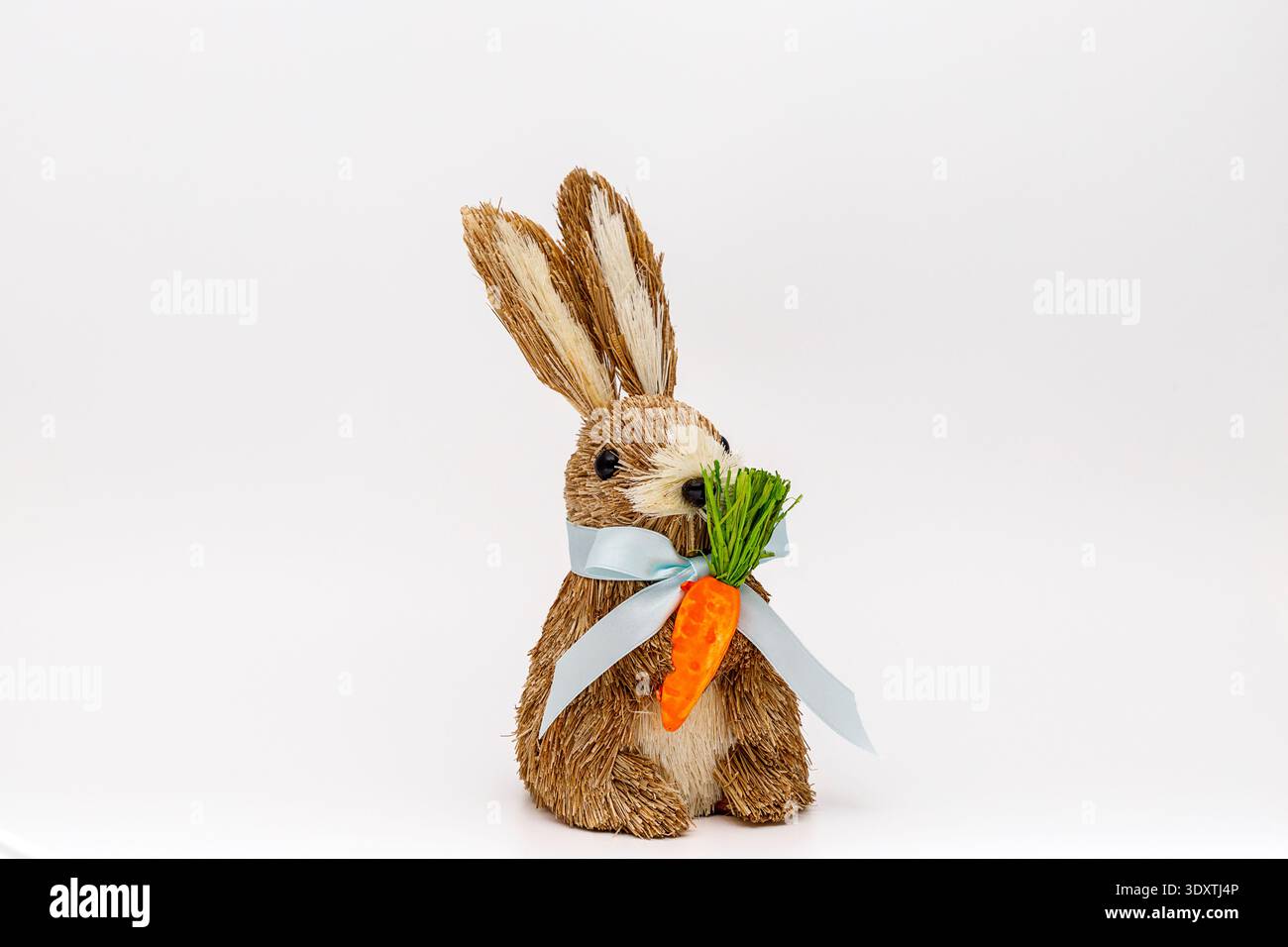 Decorative Bunny with carrot on white background Stock Photo