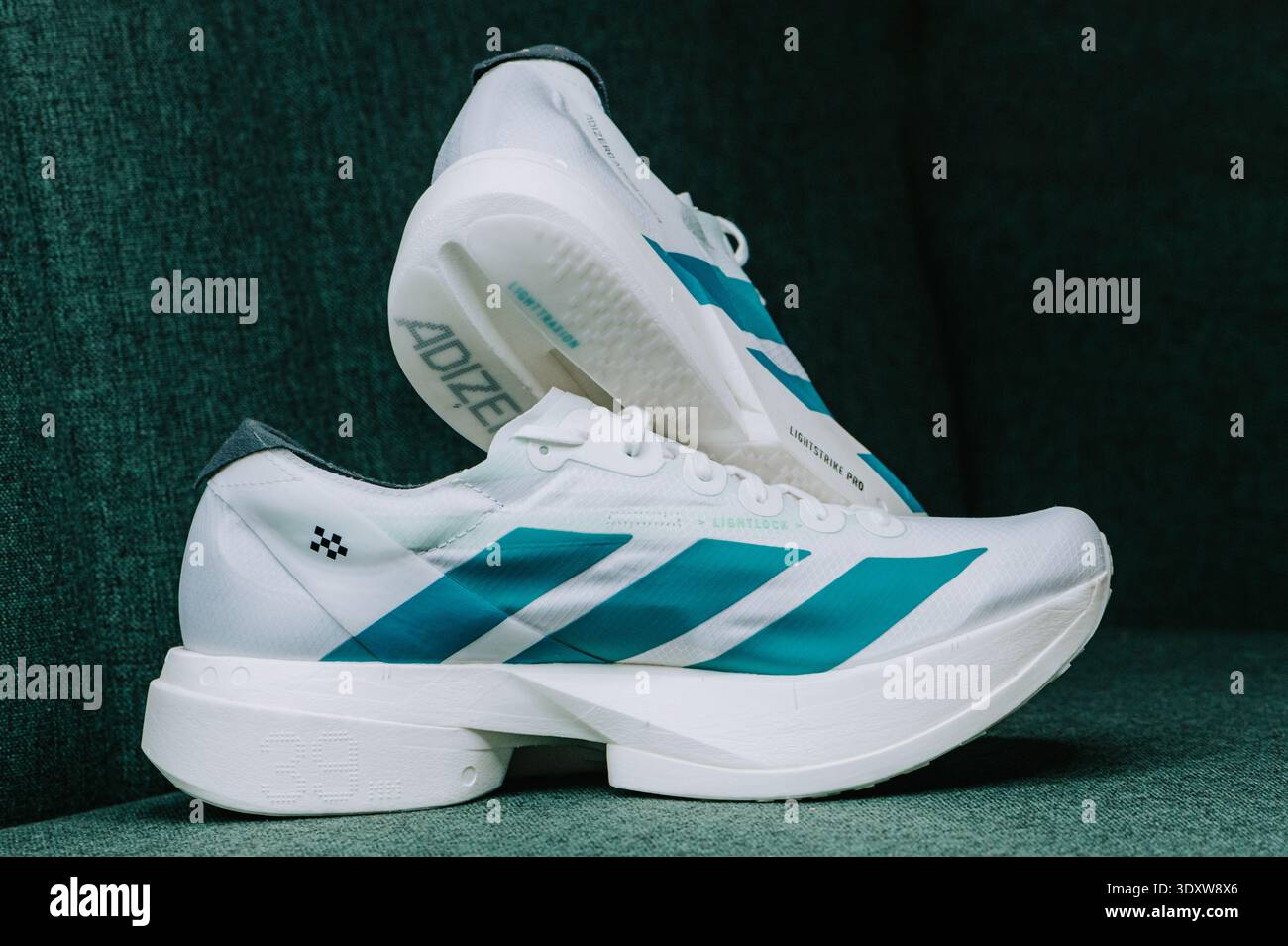 Adidas Adizero Adios Pro 4 Cloud White Pure Teal racing supershoes isolated  on white, lightweight carbon road shoes with Lightstrike Pro foam Stock  Photo - Alamy