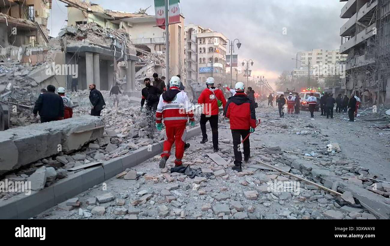 Tehran, Iran. 04th Mar, 2026. Members of Iranian rescue teams search ...