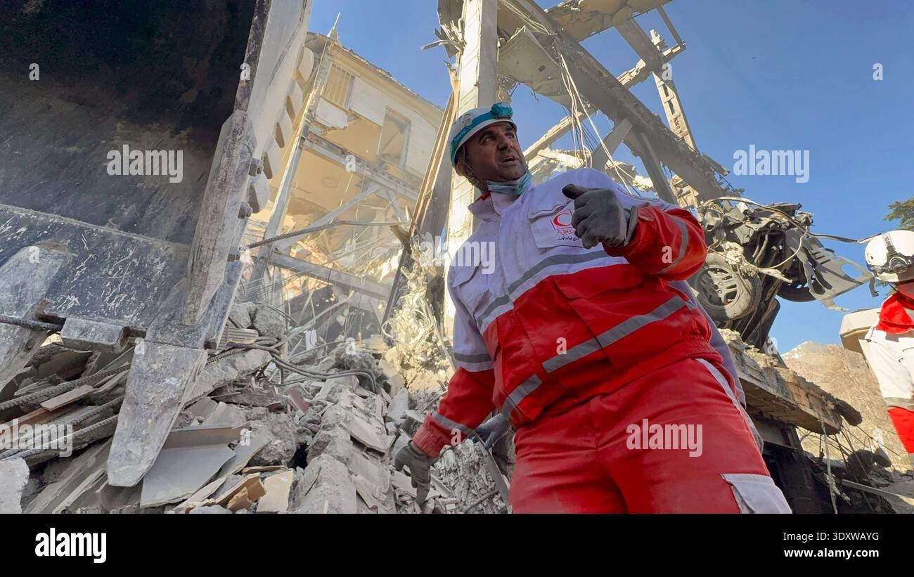Tehran, Iran. 04th Mar, 2026. Members of Iranian rescue teams search ...
