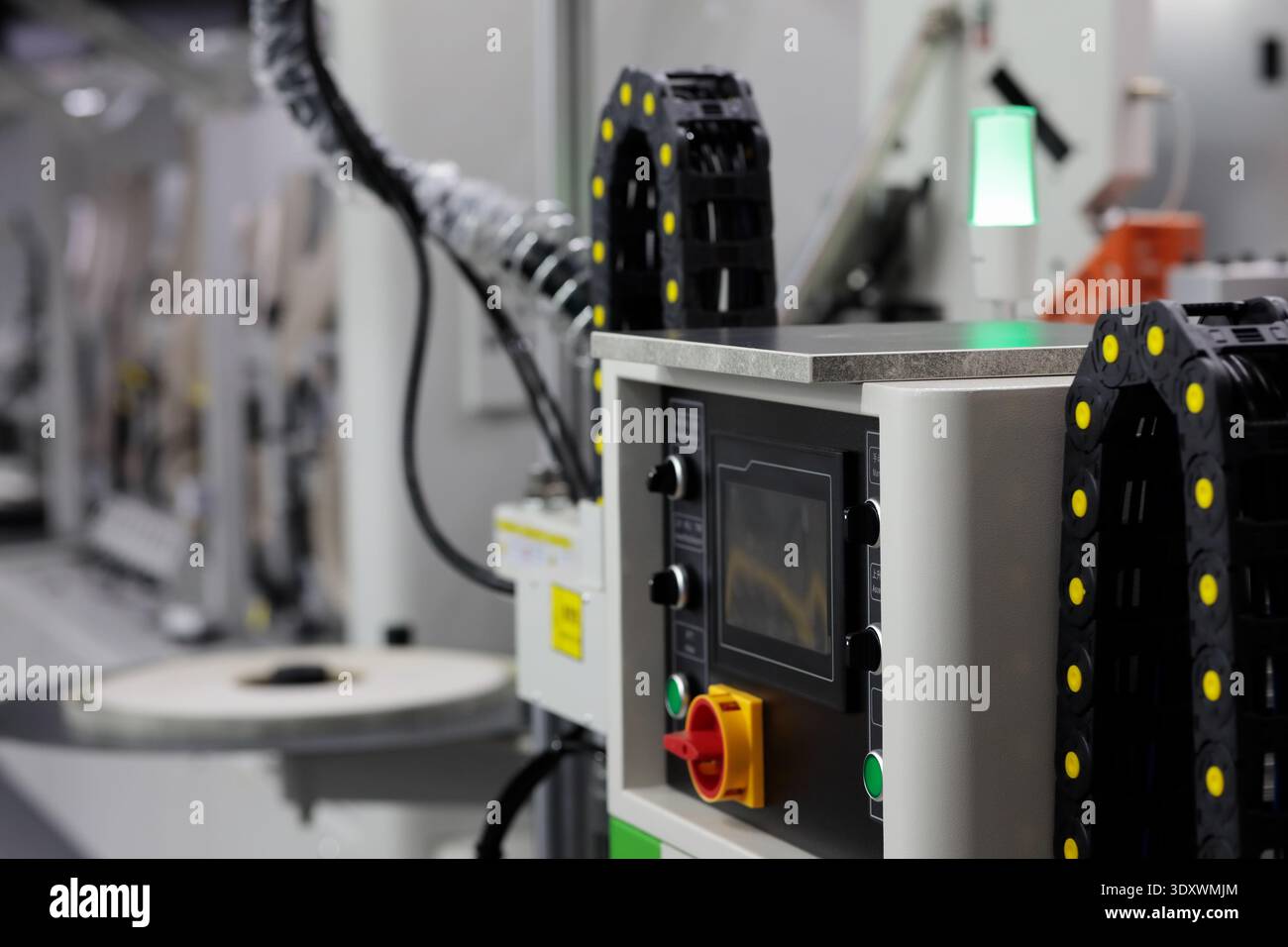 Touchscreen control console of automatic edge bander machine. Selective focus. Stock Photo