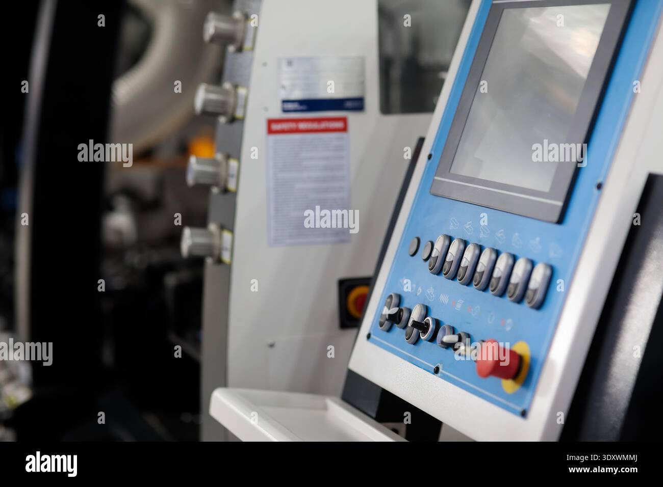 Control panel of modern automated woodworking machine. Selective focus. Stock Photo