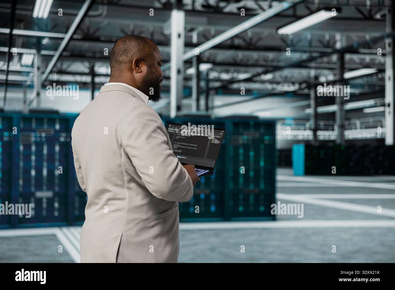 Computer scientist walking in data center running lines of code on laptop, troubleshooting rackmounts. African american software developer using programming scripts on notebook device in server room Stock Photo