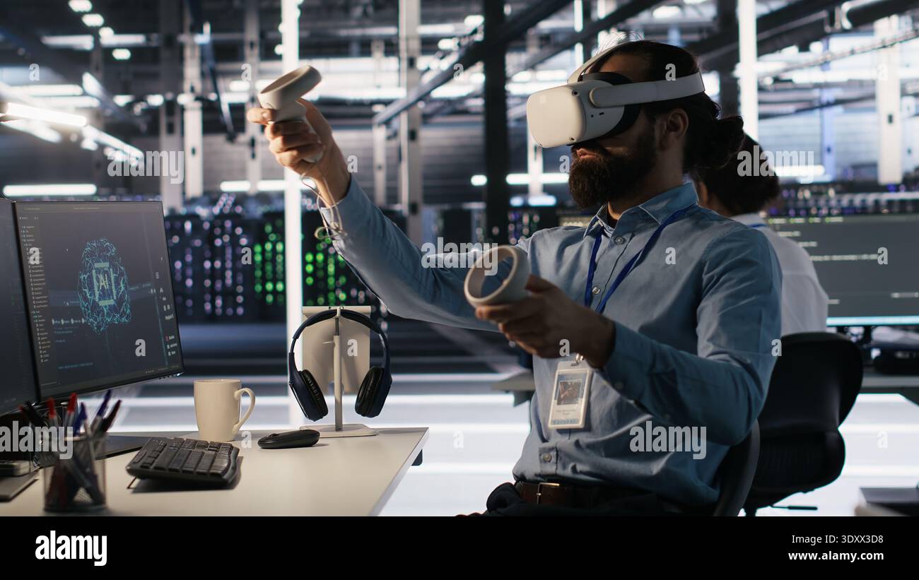 Admin using VR headset in data center to update server tech, configuring equipment using software tools. Server farm employee reviewing hardware analytics using virtual reality, camera A Stock Photo