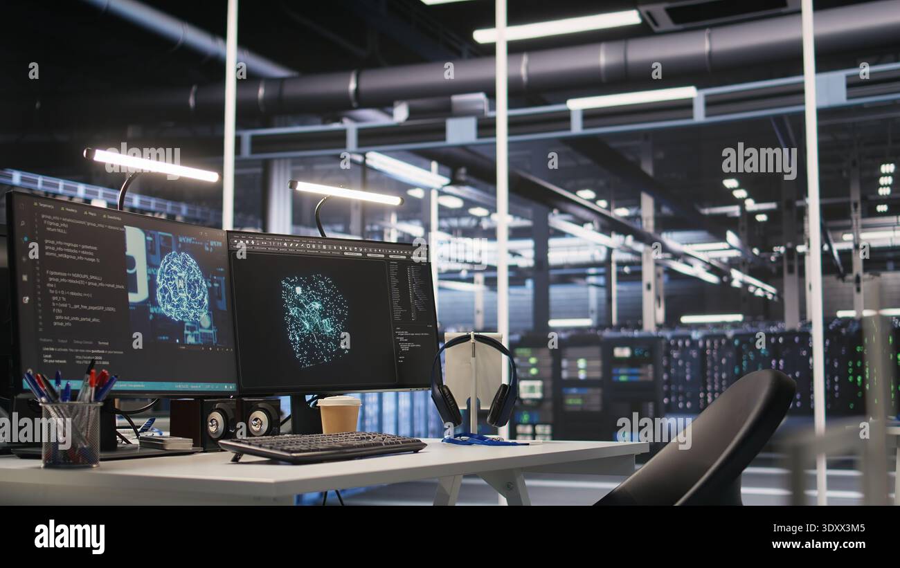 AI development workstation in data center with dual monitors displaying machine learning code. Server hub computers used for tracking neural network structures algorithm performance Stock Photo