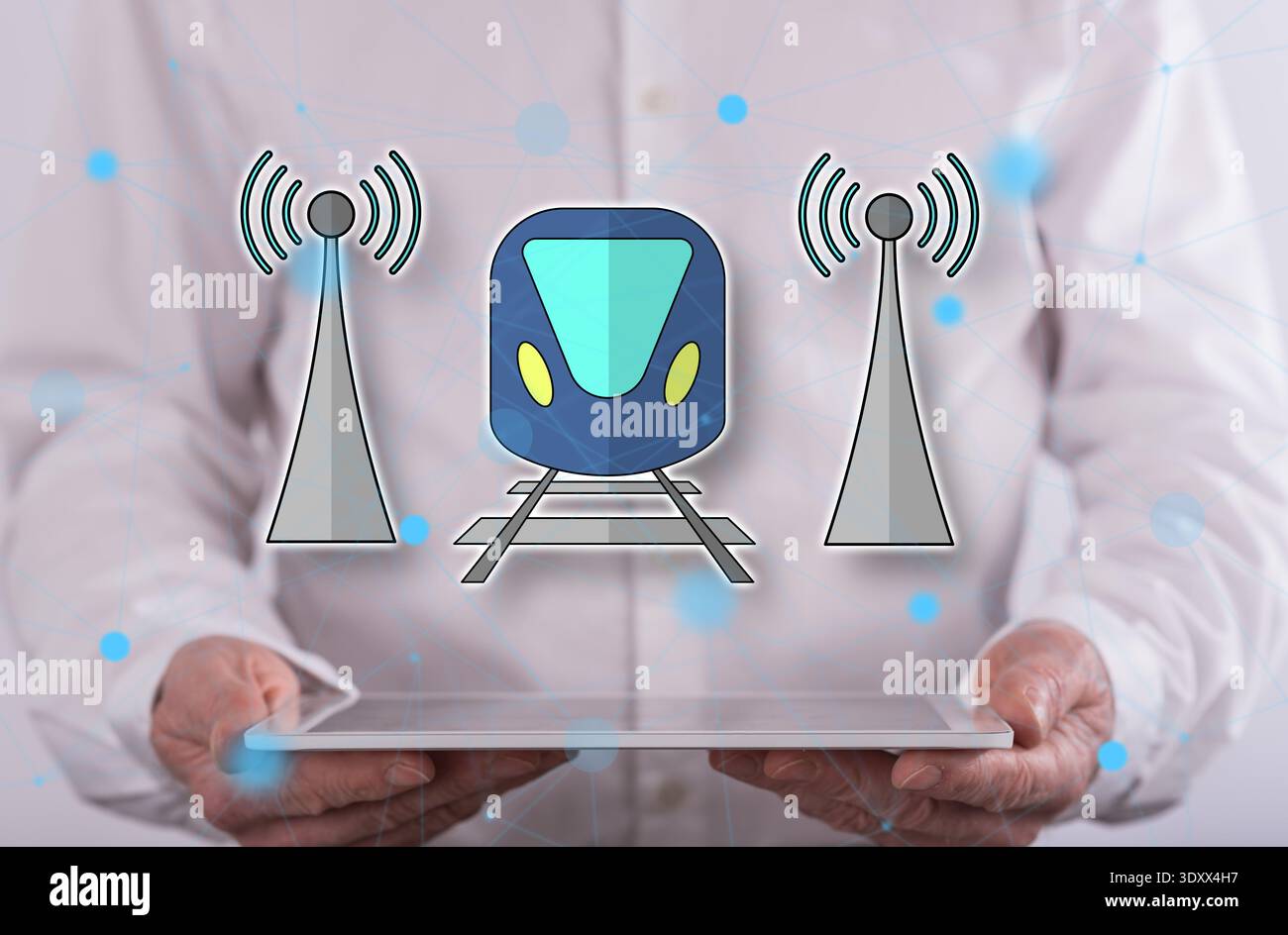 Smart train concept above a tablet held by a man in background Stock Photo