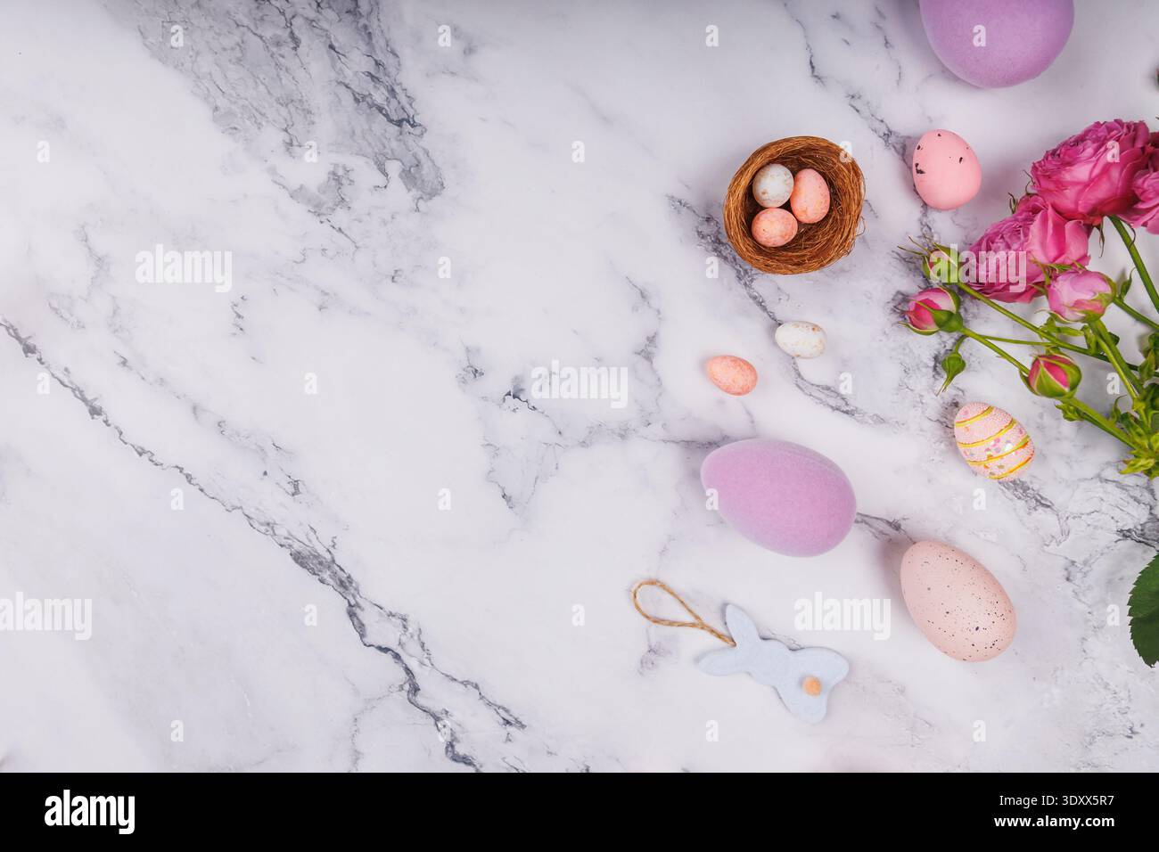Pastel Easter Flat Lay with Eggs and Roses Stock Photo