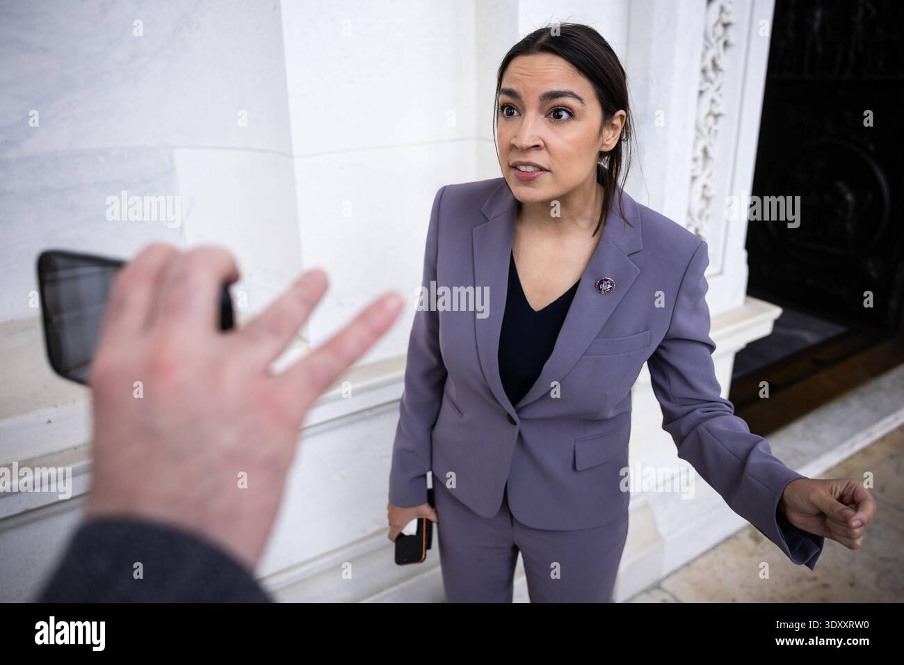 Rep. Alexandria Ocasio-Cortez (D-N.Y.) speaks with reporters as she ...