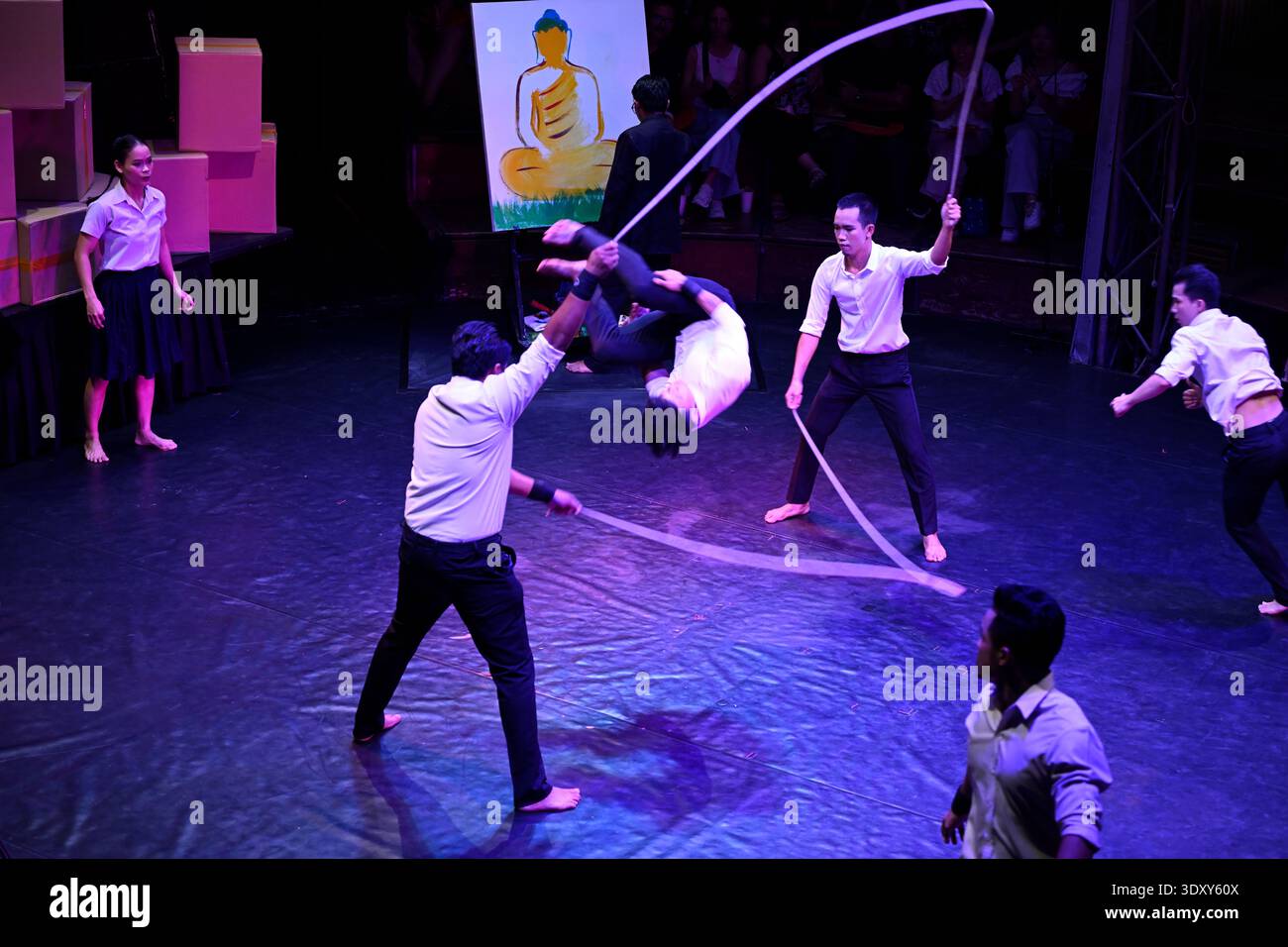 A circus troop performs a skipping act in the Phare circus production of Sokha in Siem Reap, Cambodia. Stock Photo