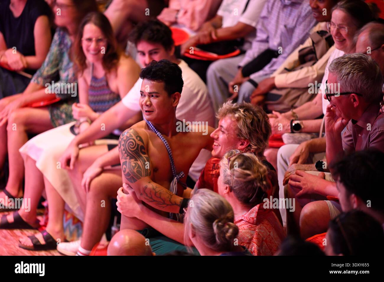 A member of the Phare circus troop involves and audience member during a performance of the show Sokha in Siem Reap, Cambodia. Stock Photo