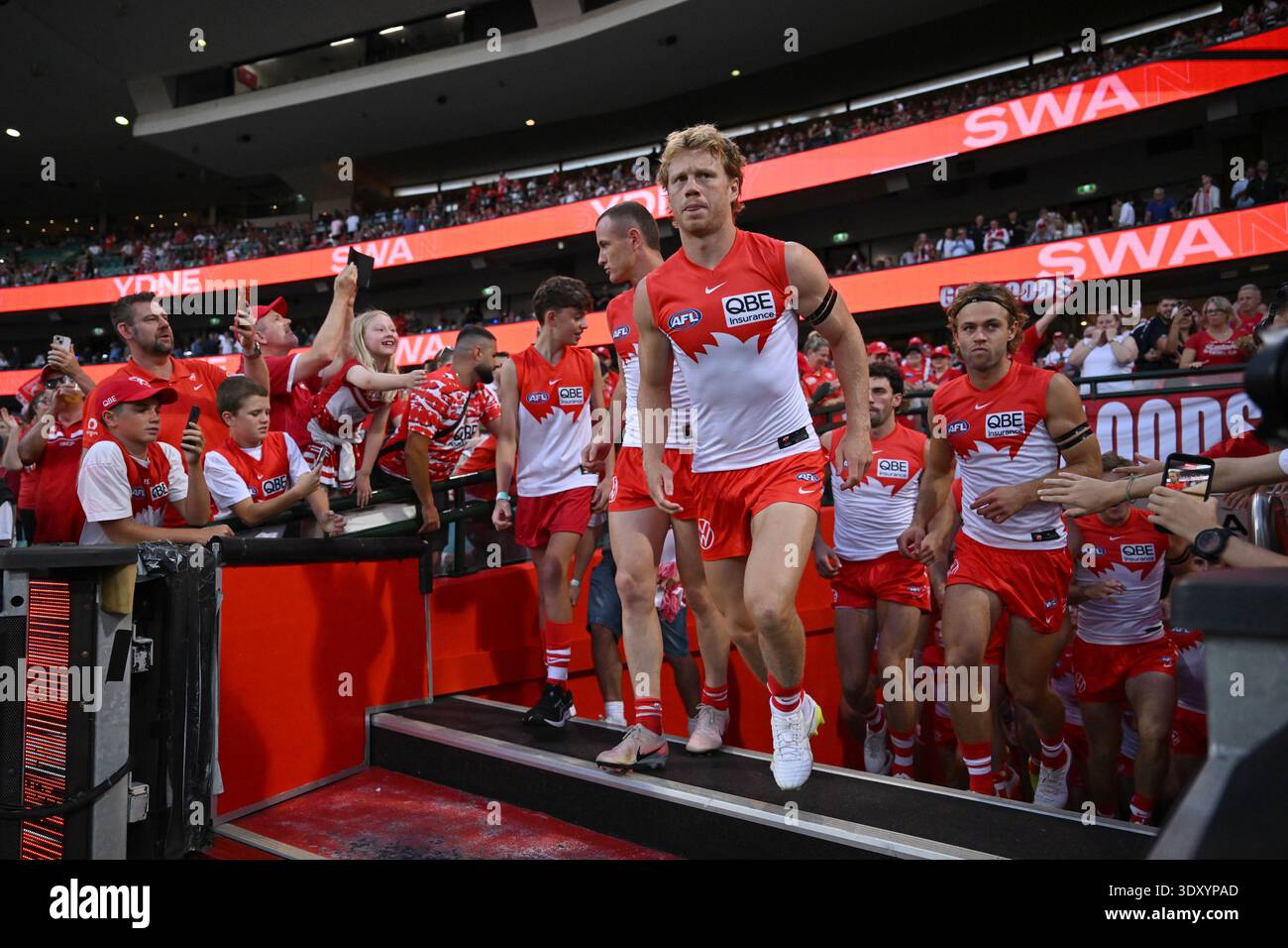 The Swans runh out on to the SCG ahead of the AFL Opening Round match ...