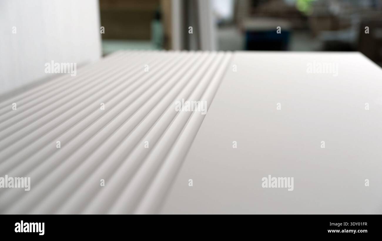 Fluted Ribbed Texture Modern white fluted furniture panel with ribbed texture, close-up view ...