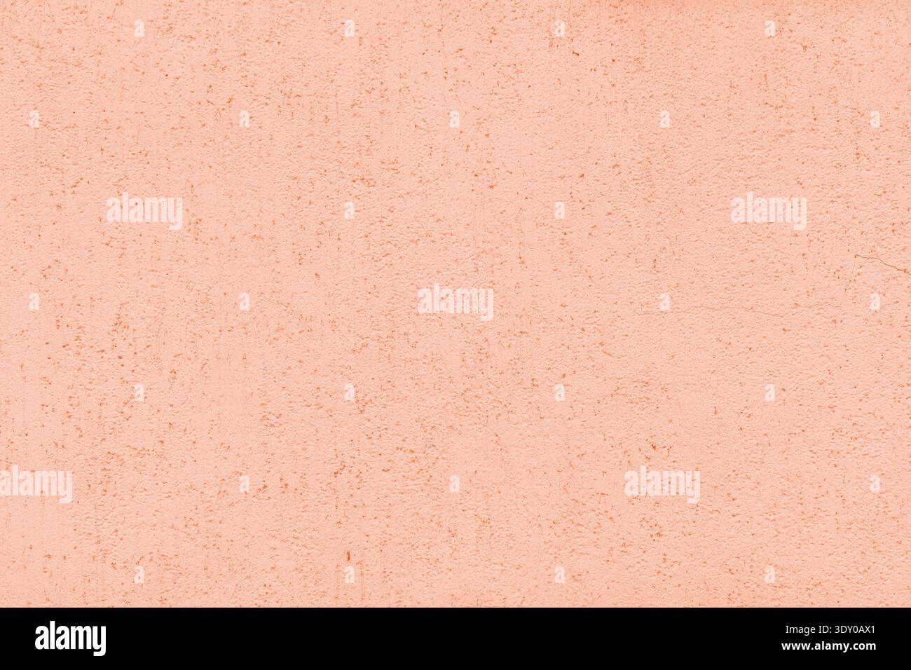 Pastel coral color old textured plaster background. Light orange rough aged exterior wall texture Stock Photo