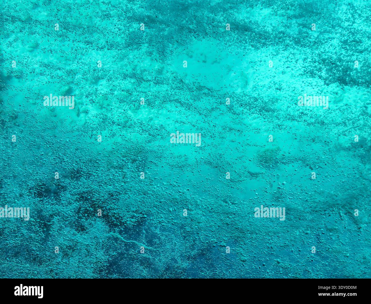 Turquoise texture of boiling water. Natural empty aqua background with air bubbles - Smartphone Captured Stock Image
