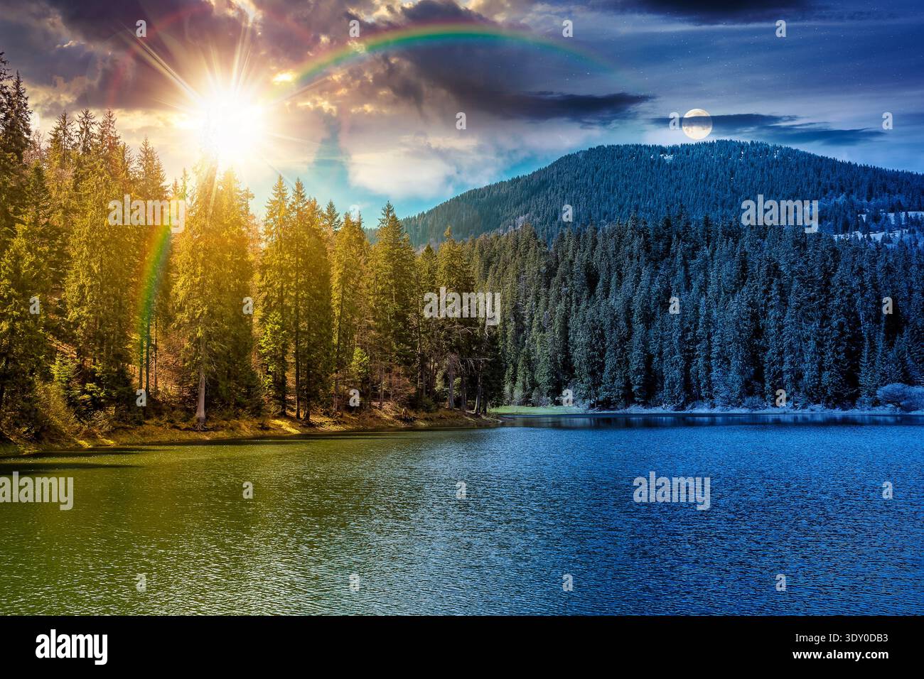mountain lake among the green spruce forest in beautiful spring landscape. day meet night. sun and moon over rippled water surface. alpine nature scen Stock Photo