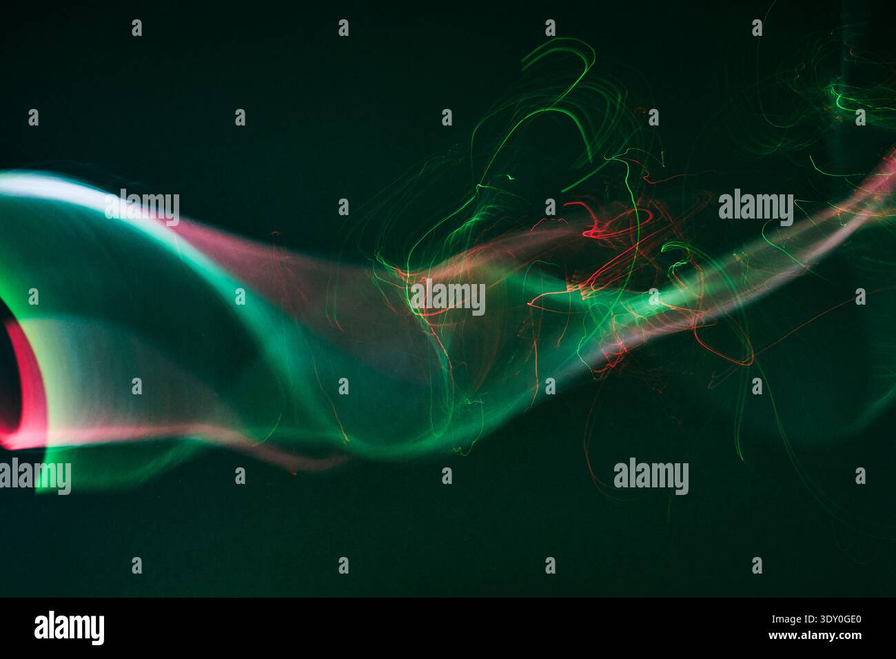 Abstract glowing light trails creating dynamic wavy lines Stock Photo