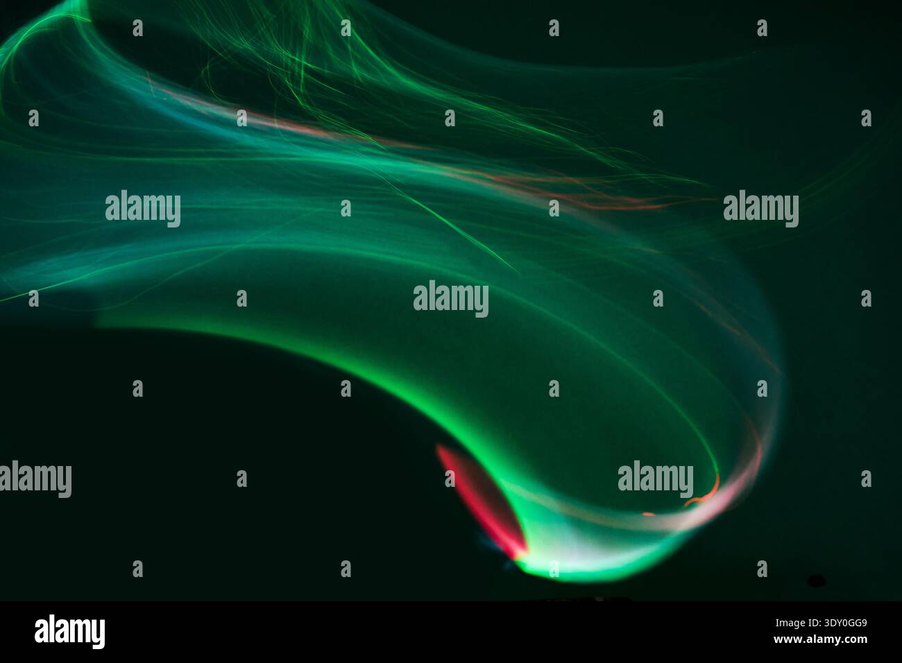 Abstract green light streaks creating dynamic energy wave Stock Photo