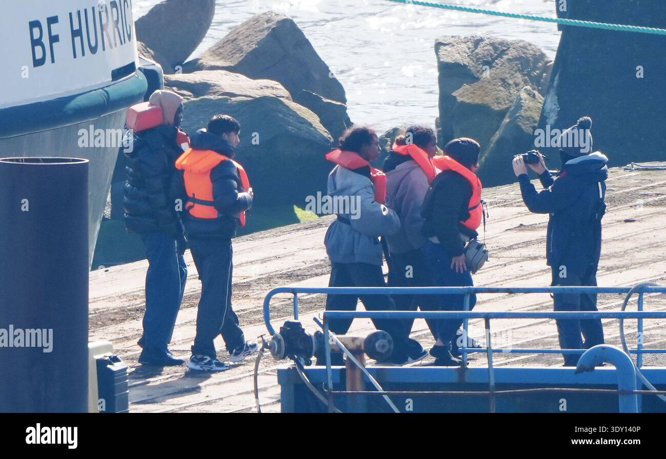 A group of people thought to be migrants arrive onboard a Border Force vessel at the Border Force compound in Ramsgate, Kent, following a small boat incident in the Channel. Picture date: Thursday March 5, 2026. Stock Photo