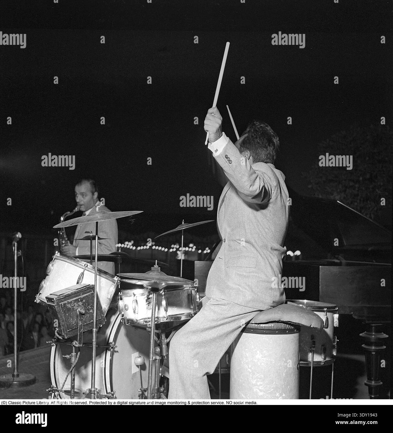 Gene Krupa. American jazz drummer, bandleader and composer. Born january 15 1909, dead october 16 1973. He was known for performing with energy and showmanship. Krupa is considered being "the founding father of the modern drumset" by Modern Drummer magazine. He was the first drummer inducted into the Modern drummer hall of fame 1978. Pictured while performing i Stockholm Sweden in July 1952 Conard ref 2063 Stock Photo