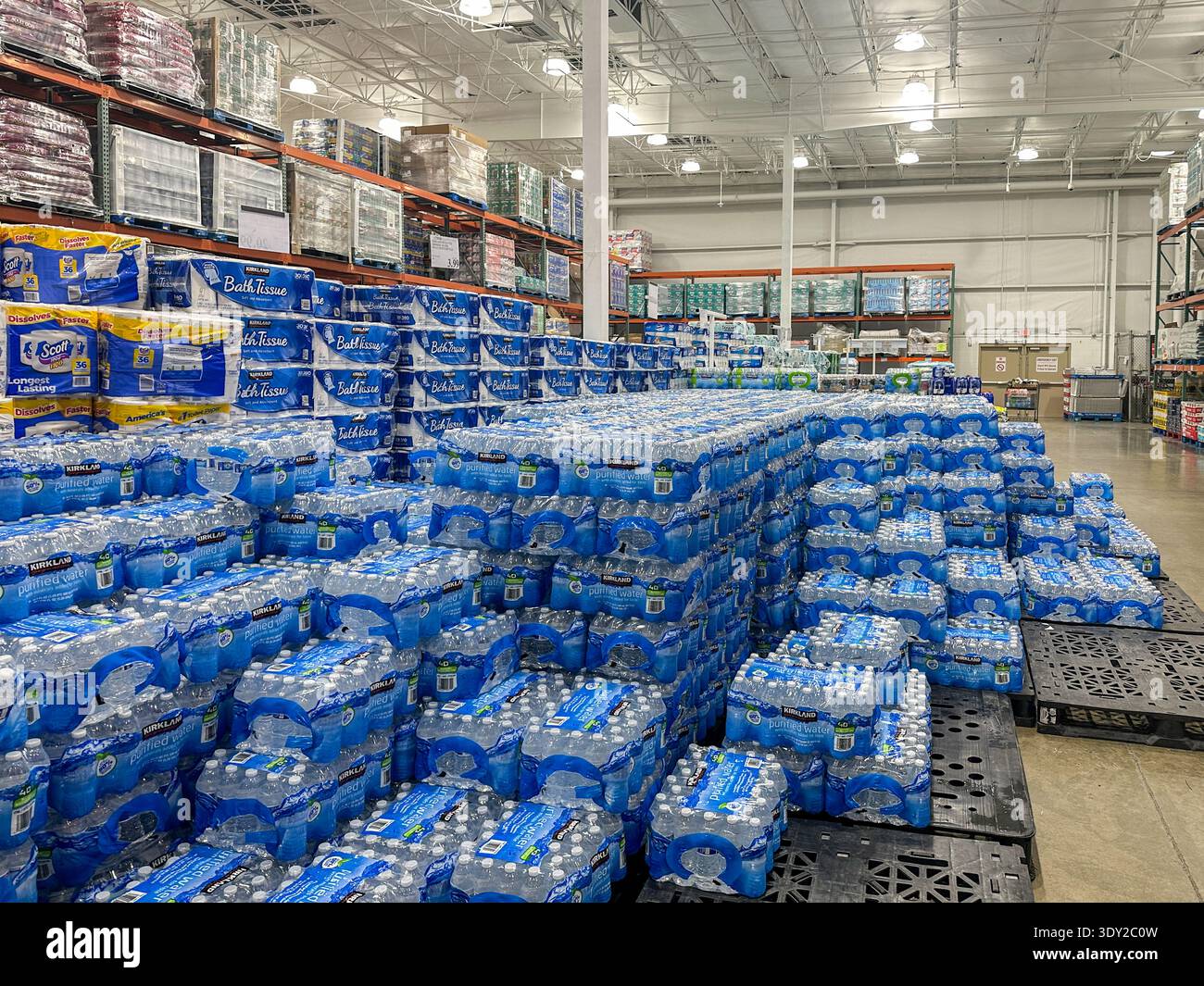 Cases of water and toilet paper for sale at a Costco store. Merrillville, IN March 4, 2026 - Smartphone Captured Stock Image