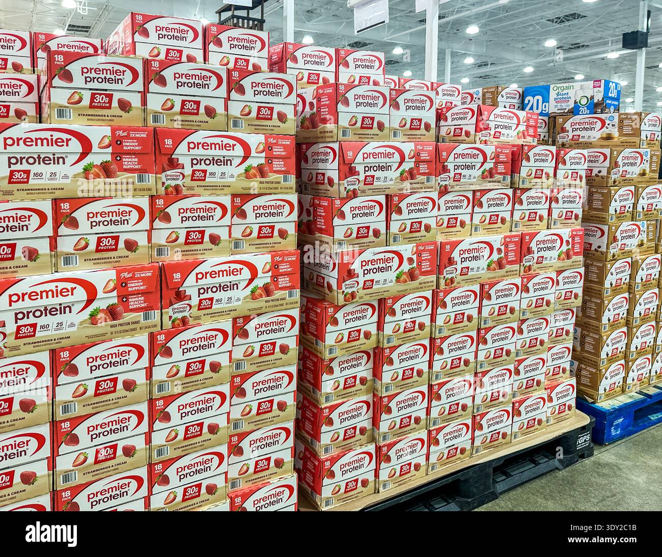 Cases of Premier Protein shakes stacked at a Costco warehouse store - Smartphone Captured Stock Image