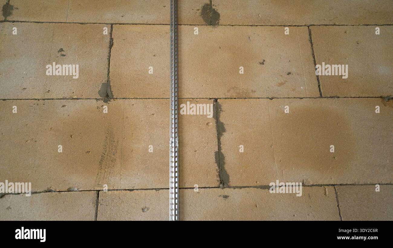 Plaster Guide on an Aerated Concrete Wall Stock Photo