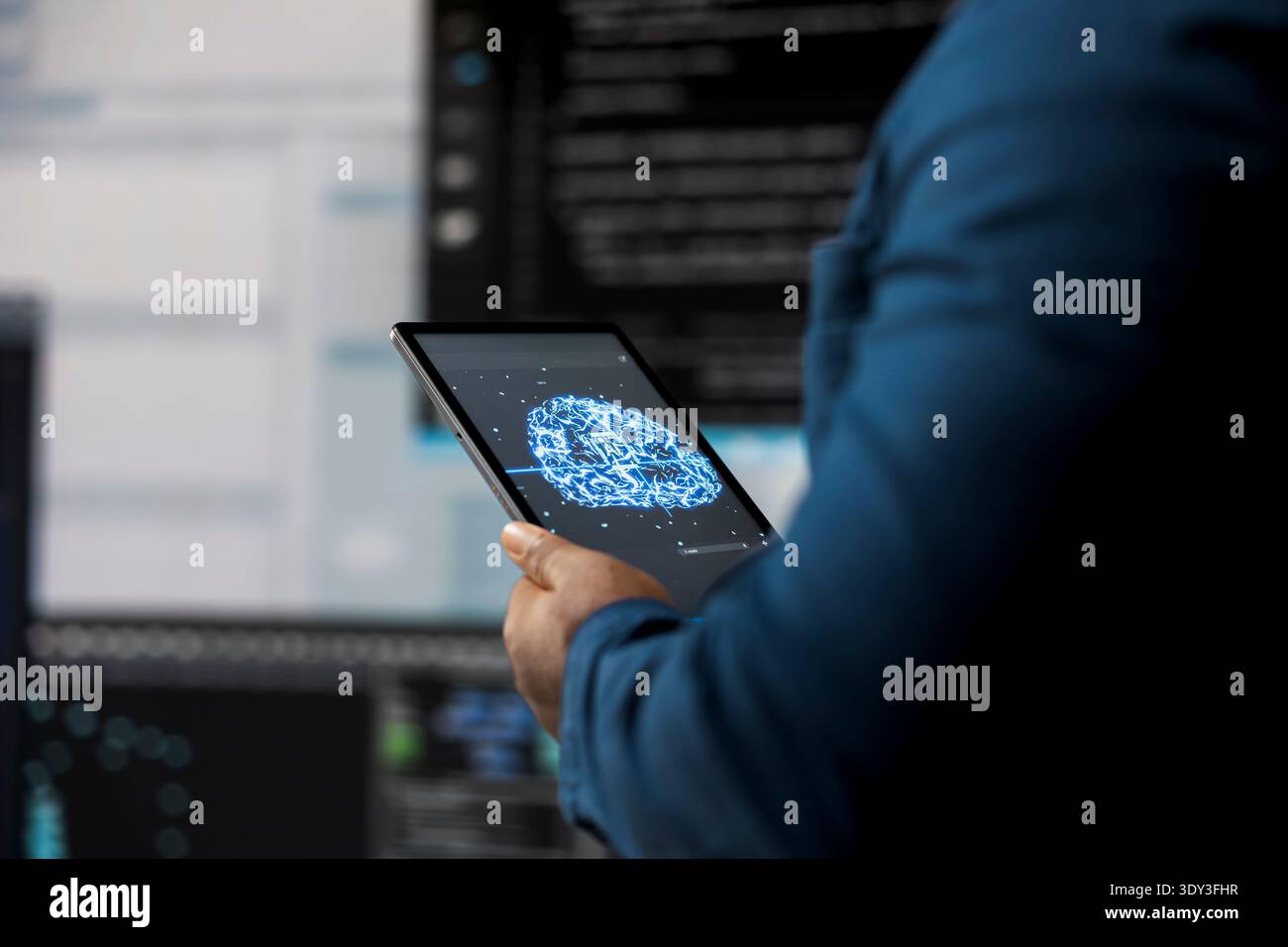 In a futuristic digital workspace, black developer programming software and explores code snippets. Tech professional embodies innovation, cybersecurity, automation and development. Stock Photo
