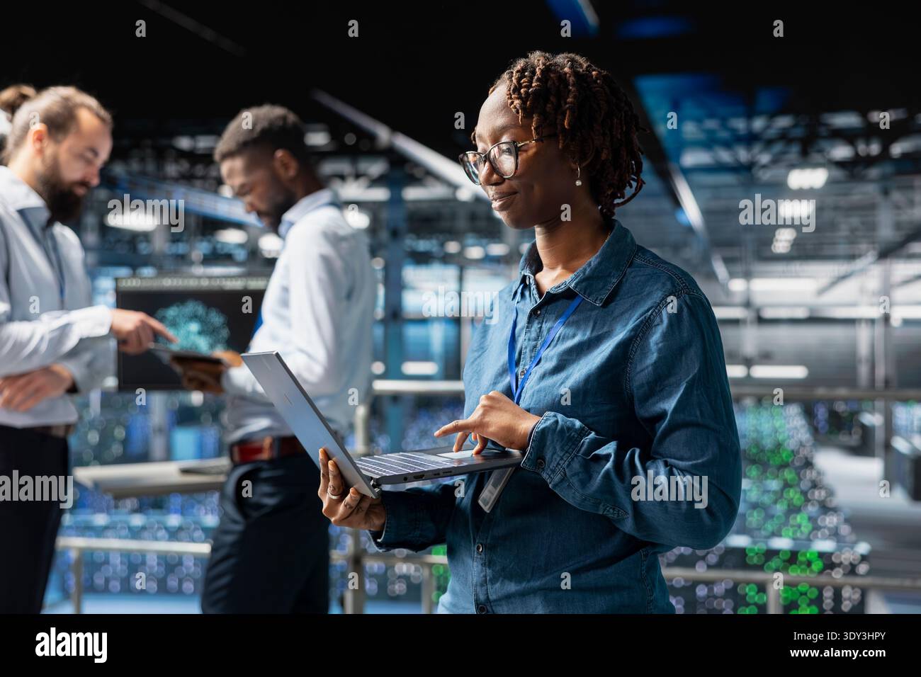 Confident black data scientist in server hub monitoring AI LLM visualization, neural network systems. Data center engineer brainstorming ideas to develop software with machine learning. Stock Photo