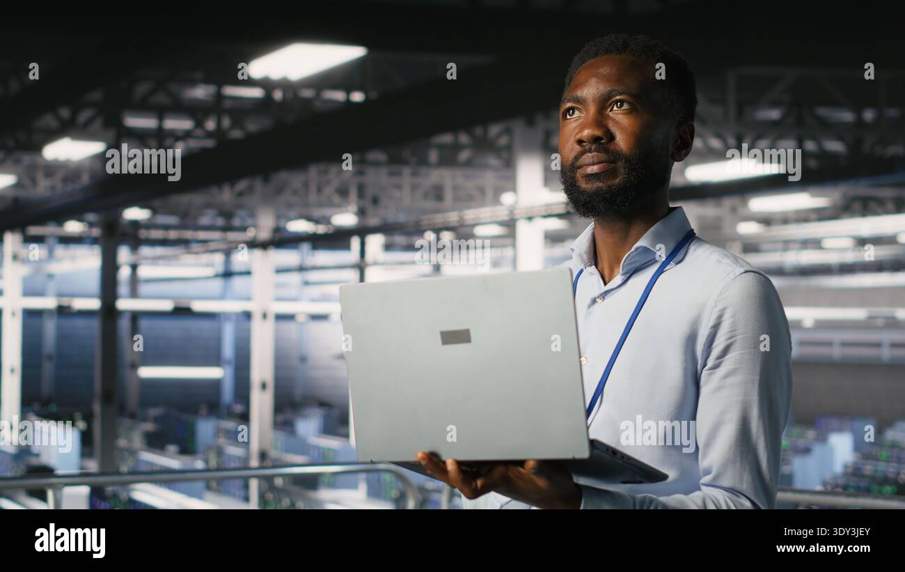 Technicians on data center industrial platform analyzing performance outputs after completing software updates. Server hub engineering team finetuning server rig configurations Stock Photo