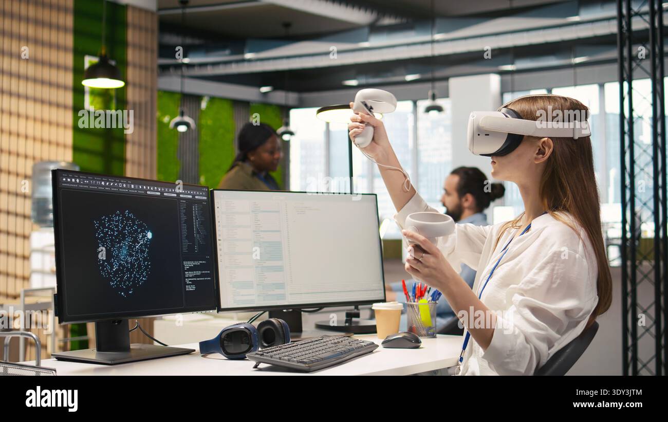 Junior dev using virtual reality at work, testing generative AI machine learning algorithms. Young woman wearing VR goggles equipment scaling productivity with AI large language model code, camera A Stock Photo