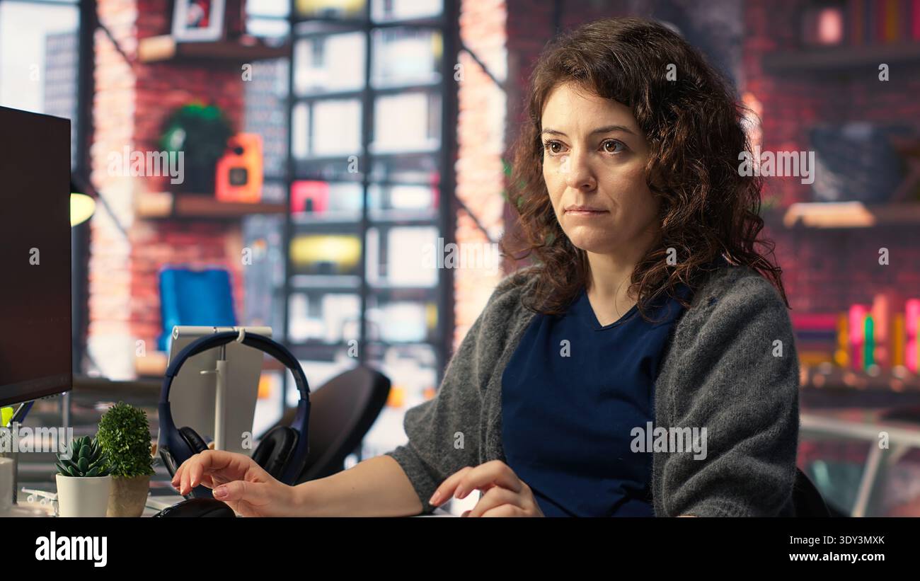 IT technician writing code and debugging on artificial intelligence neural networks computerized brain model. Female tech support doing checkup on AI systems, cloud computing. Camera B. Stock Photo
