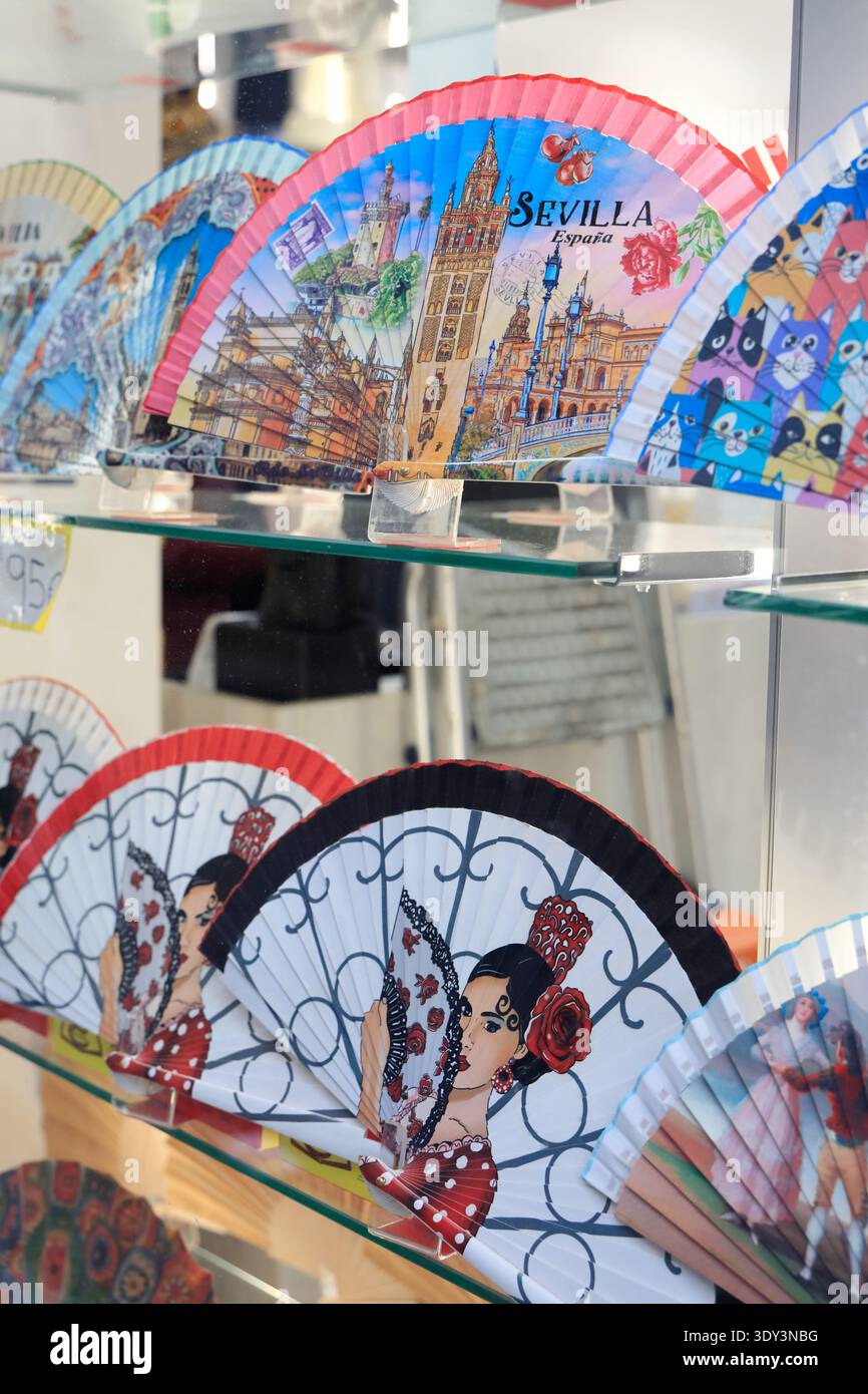 Spanish fans (abanicos) are an iconic cultural staple in Andalusia display in the window of a souvenir shop.Seville, Spain Stock Photo