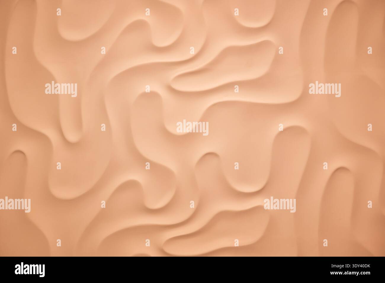 Wavy peach background creating a soft flowing abstract texture pattern Stock Photo