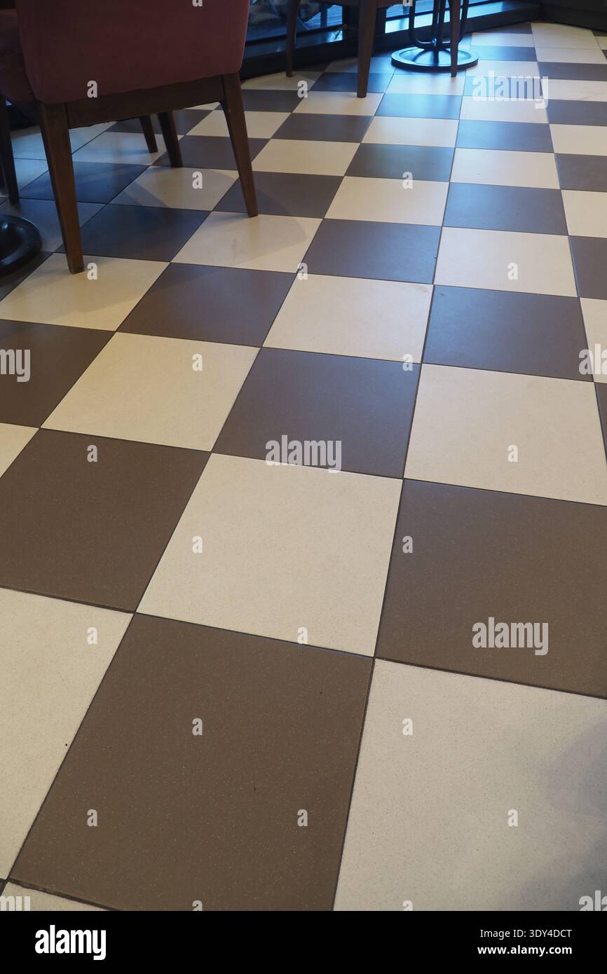 Checkered tiles in a cafe during daytime hours Stock Photo