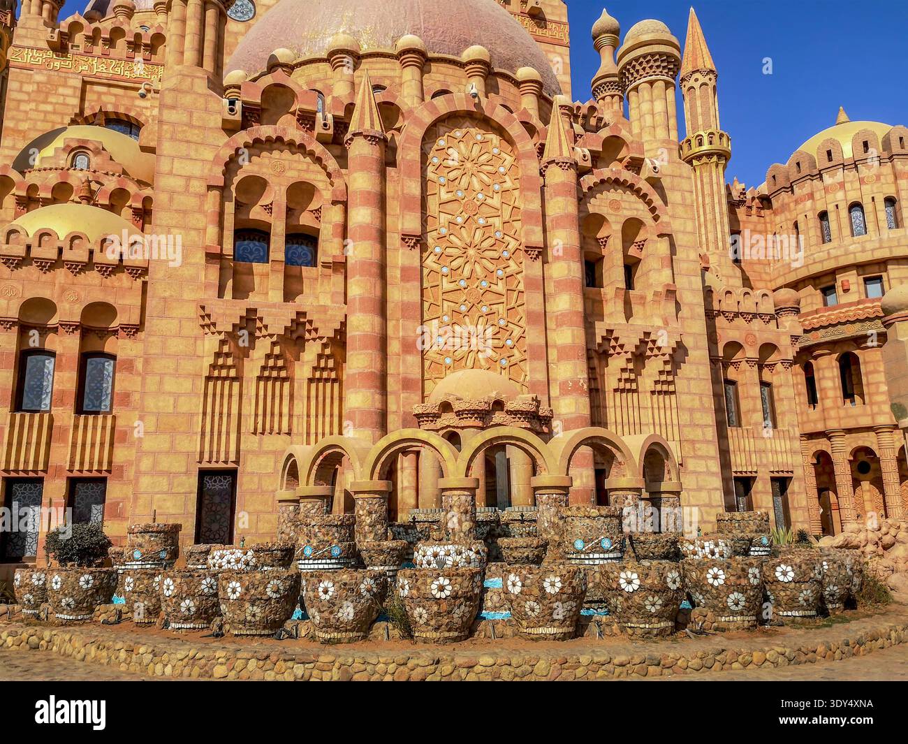 Egypt, Sharm El Sheikh - January 17, 2020: Decoration of the Al Mustafa Mosque facade with many flower vases in the Old City. Beautiful decor - Smartphone Captured Stock Image