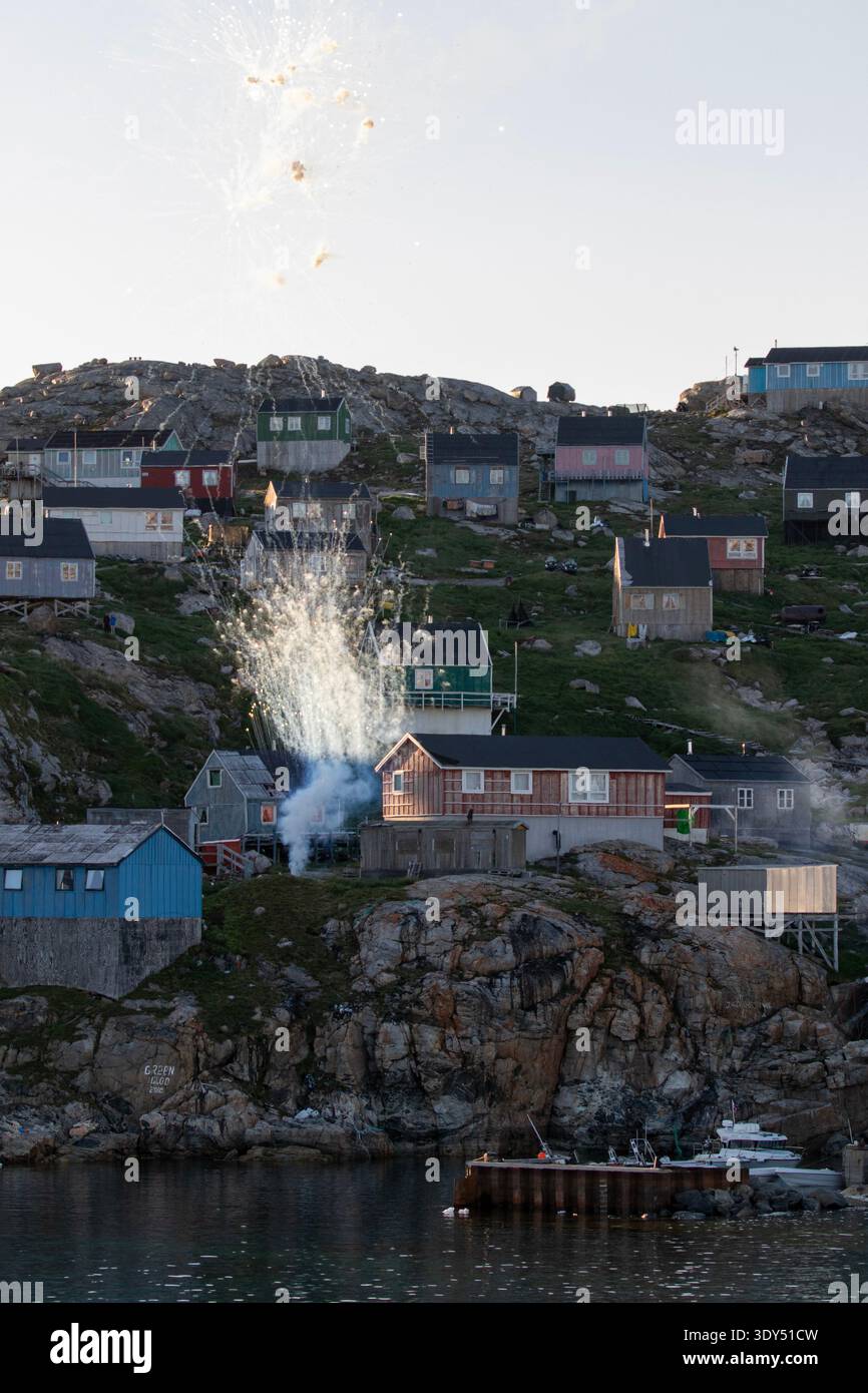 Arctic, Greenland, West Greenland, Kullorsuaq, fireworks explosion in Arctic community neighborhood Stock Photo
