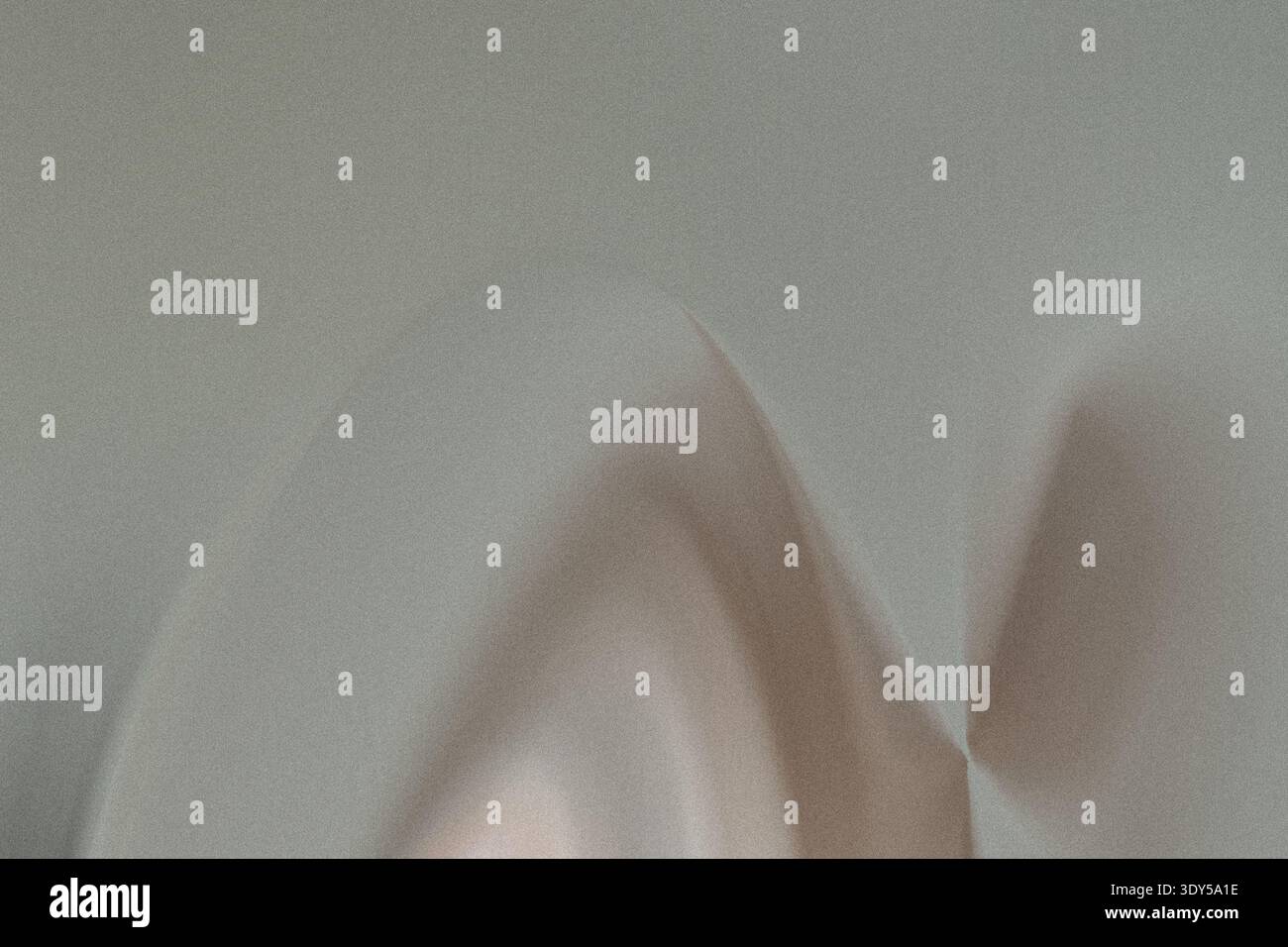 A blurry close up shot featuring two hands against a light background with soft diffused lighting effects Stock Photo