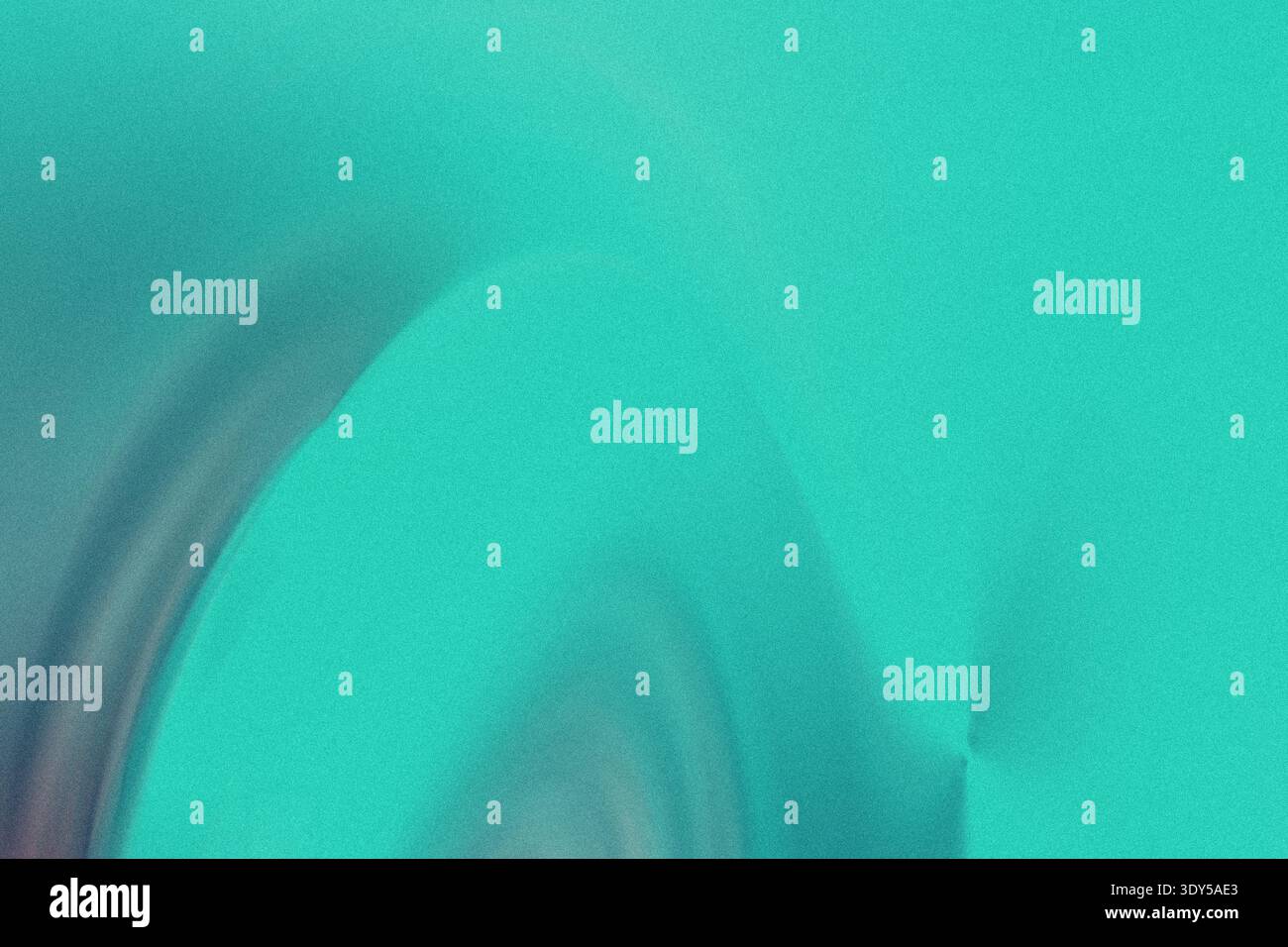 A blurry abstract image featuring a gradient of teal and turquoise colors with soft flowing textures Stock Photo