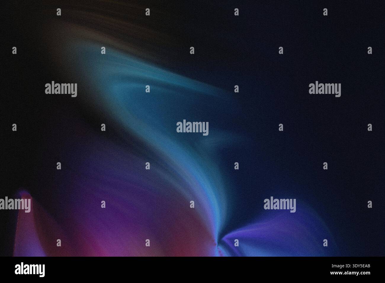 Abstract blurred background showing a gradient of blue purple and green colors with a dark background Stock Photo