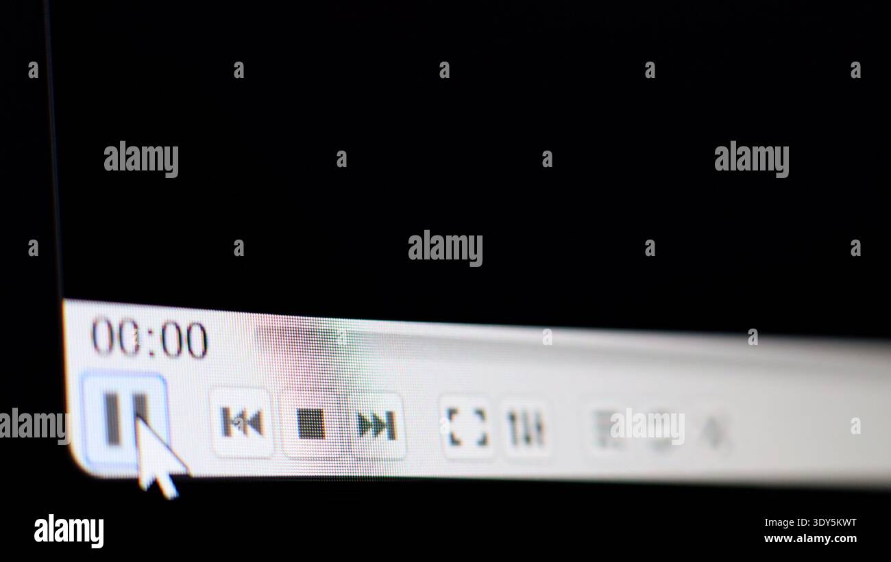 Play pause button press. Video player started, Camera shot of a computer screen Stock Photo