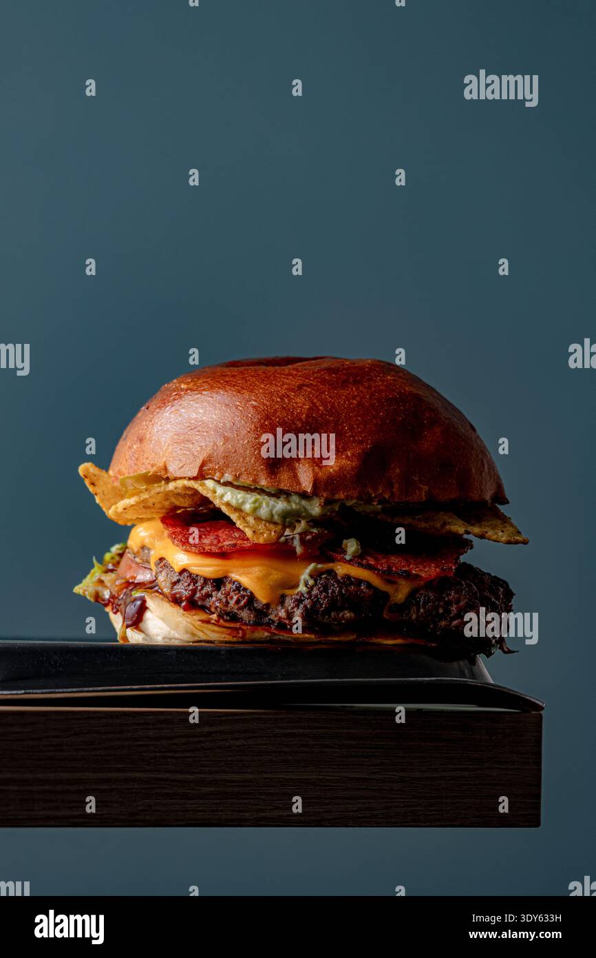 Burger on a dark background isolated with space for text Stock Photo