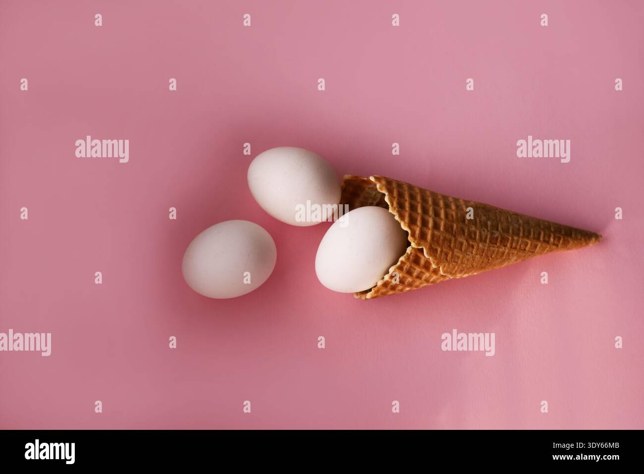 Decorative eggs placed in waffle ice cream cup Stock Photo