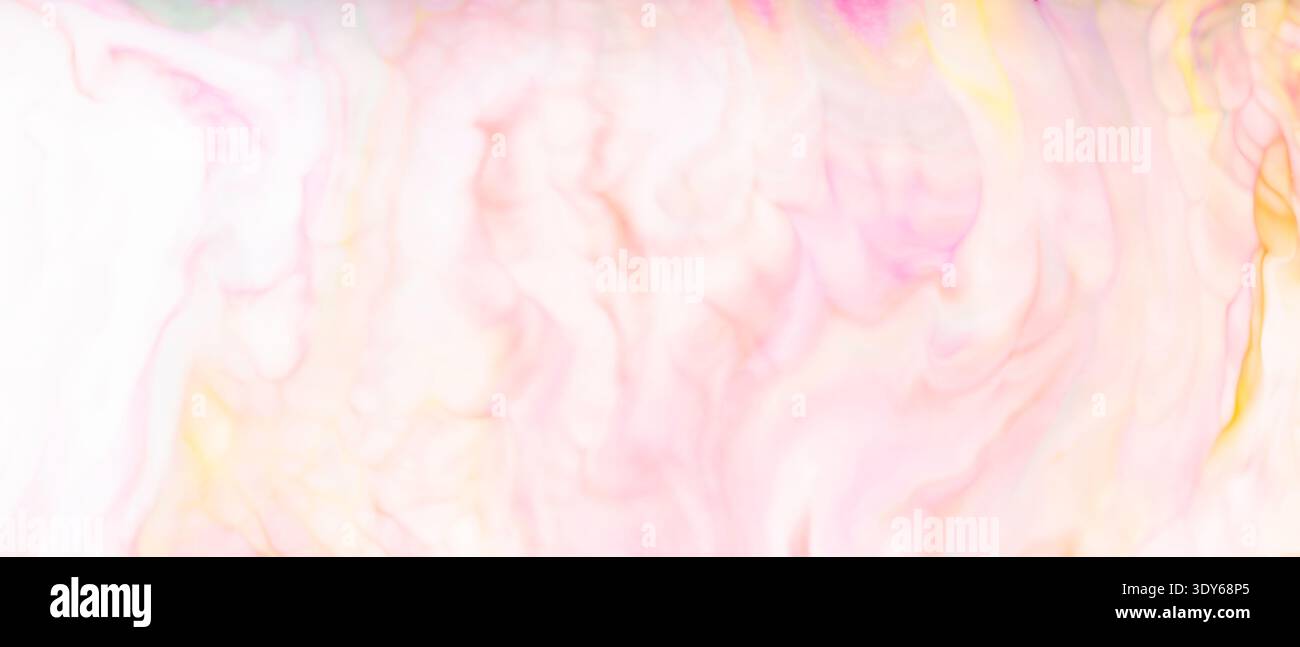 Soft pink and yellow watercolor texture with delicate pastel blending for creative backgrounds Stock Photo